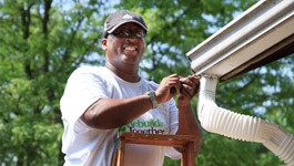 Scottrade associate volunteering to help Rebuilding Together