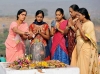 Women worshipping Shiva Lingam